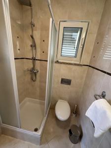 Kúpeľňa v ubytovaní Pool Apartment Galeb
