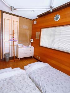 Voodi või voodid majutusasutuse T&T Fujiyama Guest House toas