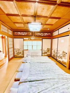 Voodi või voodid majutusasutuse T&T Fujiyama Guest House toas