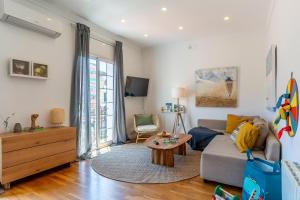 a living room with a couch and a table at Canela Homes BARCELONA FIRA in Barcelona