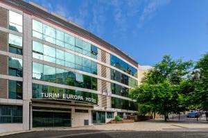 a building with a sign on the side of it at TURIM Europa Hotel in Lisbon