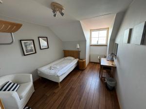 Postel nebo postele na pokoji v ubytování Gryts Sea Lodge