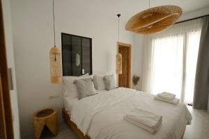 Postel nebo postele na pokoji v ubytování Athos Guesthouse