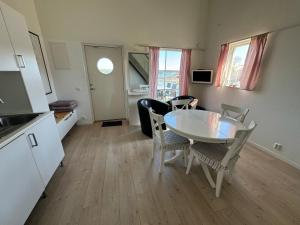 TV a/nebo společenská místnost v ubytování Gryts Sea Lodge