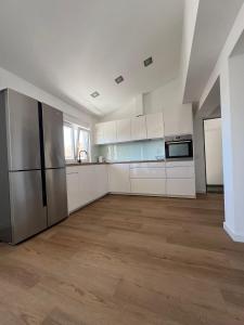 Kuchyň nebo kuchyňský kout v ubytování City Apartments Nada