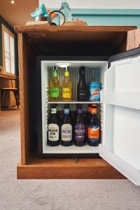 a refrigerator filled with lots of bottles of beer at Mill on the Exe in Exeter