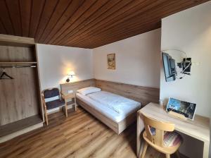 Postel nebo postele na pokoji v ubytování Gasthof Moarwirt