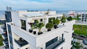 an apartment building with plants on the balconies at CCD Seaview Apartments in Năvodari