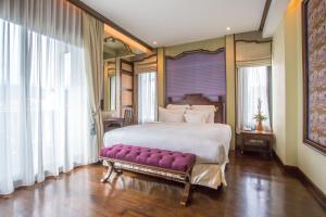 Postel nebo postele na pokoji v ubytování Chankam Boutique Hotel + 37 fotografií