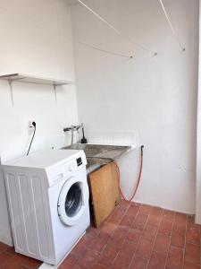 Kuchyňa alebo kuchynka v ubytovaní Ap NURIMAR 2 con Aire Acondicionado en Centro del Pueblo