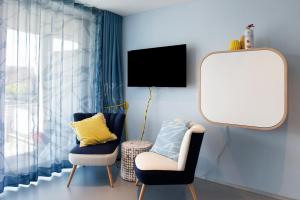 Televisyen dan/atau pusat hiburan di Seeart-apartment No 86