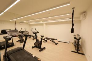 a gym with several exercise bikes in a room at Casas do Forte Wood 6pax Piscina Privativa by Portugal Hideaway in Tavira