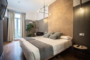 Łóżko lub łóżka w pokoju w obiekcie Suites You Zinc