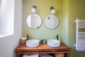 a bathroom with two sinks and two mirrors at -LE SENTIER- Elegant T3 avec jardin proche mer in Concarneau +28 photos