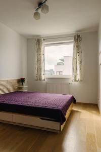 En eller flere senge i et værelse på Apartament Morski