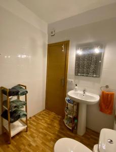 a bathroom with a sink and a toilet at Sol y luna in Manzaneque