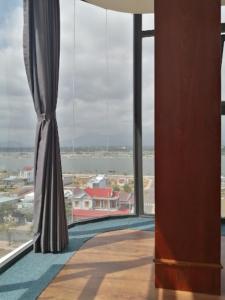 a large window with a view of the ocean at Hoang Sa Bai Dai Hotel in Cam Ranh