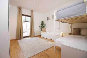 Postel nebo postele na pokoji v ubytování Apartmenthaus ROSE