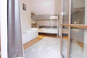 Postel nebo postele na pokoji v ubytování Apartmenthaus ROSE