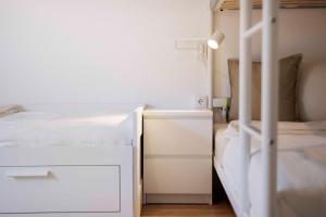 Postel nebo postele na pokoji v ubytování Apartmenthaus ROSE