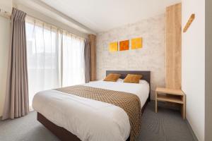 Postel nebo postele na pokoji v ubytování Komachi Hotel Nipponbashi