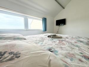 Кровать или кровати в номере L'Opaline - Vue mer