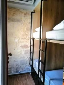Postel nebo postele na pokoji v ubytování Hippie City Hostel
