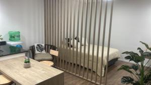a bedroom with a bed with vertical blinds at Hospedaje posada en Ezeiza in Ezeiza