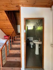 a bathroom with a sink and a toilet in a room at Guesthouse Kroni I Micanit in Theth +37 photos