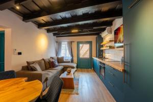a living room with a couch and a table at Casa Albastră by Casa Otto in Sighişoara +34 photos
