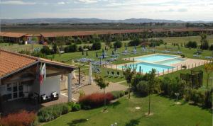 an aerial view of a resort with a swimming pool at Residenza Principina in Principina Terra