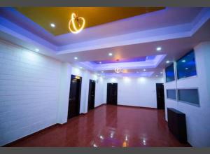 an empty room with a white wall and a ceiling at Bandipur Resort Khan's Gufa in Gundlupet