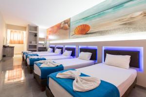 Postel nebo postele na pokoji v ubytování Savvas Hotel