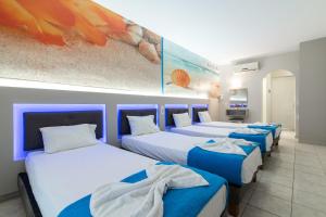 Postel nebo postele na pokoji v ubytování Savvas Hotel