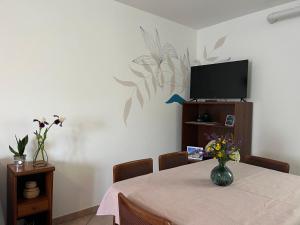 TV a/nebo společenská místnost v ubytování Casa Palidà