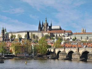 a view of a city with a bridge over a river at The Mozart Prague in Prague