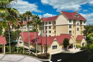 an aerial view of a hotel with palm trees at Residence Inn Orlando Convention Center in Orlando