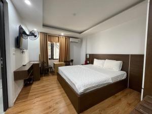 En eller flere senge i et værelse på Noi Bai Airport Hotel