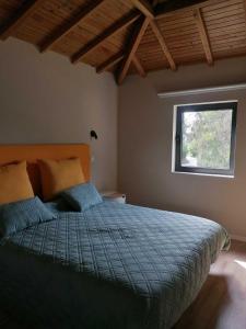 Säng eller sängar i ett rum på Casa dos Matos