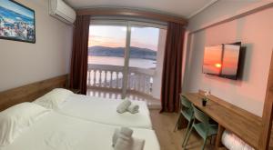 Hotel Dodona 객실 침대