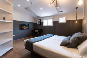 Łóżko lub łóżka w pokoju w obiekcie Suites You Zinc