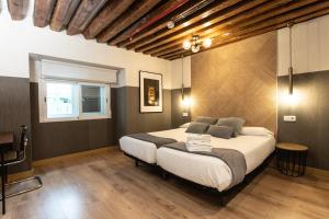 Łóżko lub łóżka w pokoju w obiekcie Suites You Zinc
