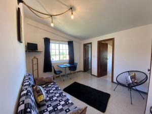 a living room with a couch and a table at Apartamentos Blanco Y Negro in A Guarda