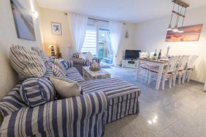 a living room with two couches and a table at Ferienhaus Kranich in Pruchten