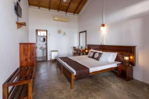 Postelja oz. postelje v sobi nastanitve Pearl Oceanic Resort - Trincomalee