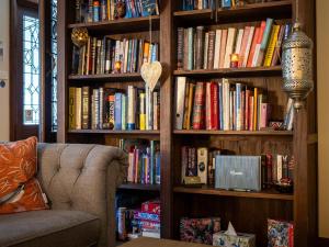a book shelf filled with lots of books at Serenity House Pemberton & Wellness Spa in Pemberton