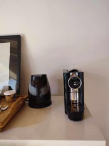 a coffee maker sitting on top of a counter at Homestay Attic Private Bedroom in Aljezur