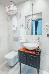 a bathroom with a sink and a toilet at Ferman Port Hotel - Special Category in Istanbul