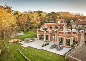 an aerial view of a large brick house at The Ballroom in Blakeney