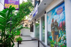 a store with a mural on the side of a building at SkyAvenue Guest House in Kadawata